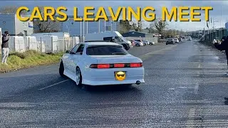 cars leaving meet in style sideways and one wheel action 