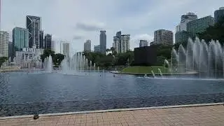 Relaxing noon KLCC Fountain at the Esplanade Petronas Twin Towers KL Kuala Lumpur