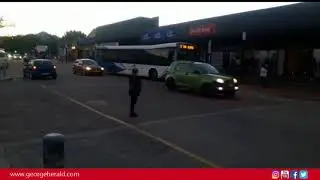 Excited people boarding the GO GEORGE buses