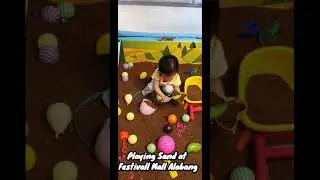 Playing sand beach toys at Festival Mall Alabang