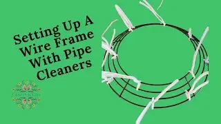 Putting pipe cleaners on a  wire wreath frame