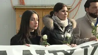 Swiss town holds silent march for its youngsters killed in New Year fire | AFP