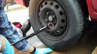 How to change a flat tire on a car