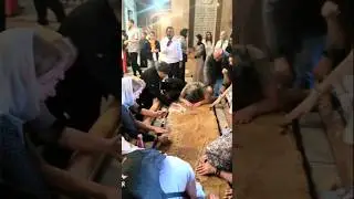 Pilgrims Cover the Anointing Stone with Prayer - Holy Sepulchre Jerusalem