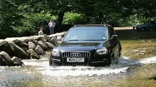 Cars drive through ford at Tarr Steps (clapper bridge), Exmoor UK