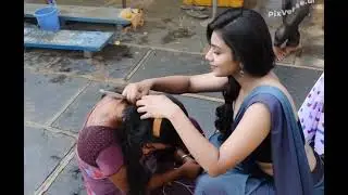 Young women headshave by girl. 