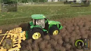 farming simulator 25 game play in the john Deere tractor