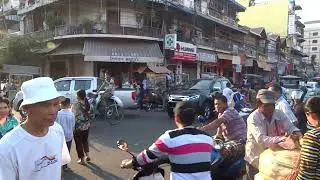 Crowded Cambodian market during rush hour