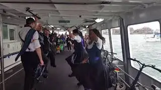 Victory day of dance on Gosport ferry with customs and exiles.