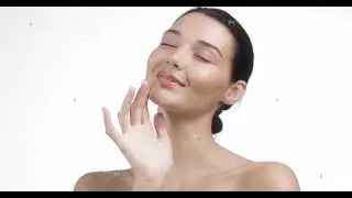 Young Woman with Smooth Skin Practicing Skincare Routine on White Background