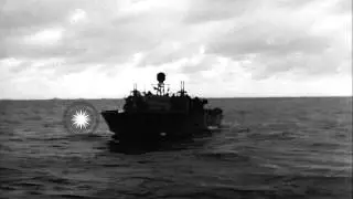 A damaged LCT and other landing craft vehicles underway during D-Day invasion HD Stock Footage