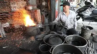 The last blacksmith on Kiln Street, Hanoi, Vietnam