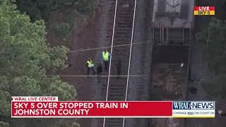 Sky 5 over stopped train after pedestrian accident in Johnston County