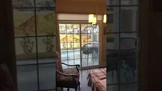Motorized roller shades for sliding glass doors