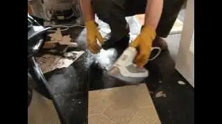 Removing Vinyl Floor Tiles with an Electric Steam Iron.