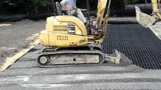 Infill Being Spread Across the GEOPAVE&reg; Aggregate Porous Pavement System