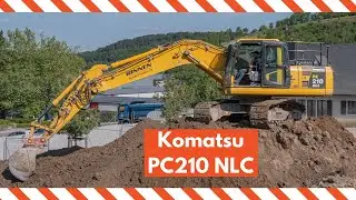 Komatsu PC 210 excavator loading trucks in Luxembourg