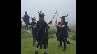 Kittys Cottee at Grimspound Settlement, Dartmoor, Devon, with Grimspound Border Morris