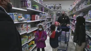 Children go on shopping spree with Louisville Metro Corrections officers