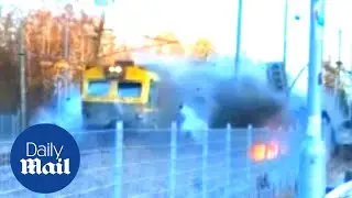 Train crashes THROUGH bus before derailing in Sweden