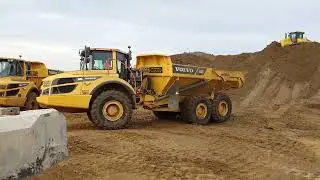 Volvo A30G Dump Truck tipping topsoil on heap in Essex