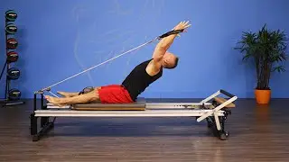 Roll Down with Extension on the Pilates Reformer