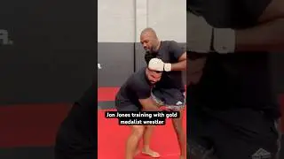 Jon Jones lands knee on Olympic gold medalist wrestler, Gable Steveson.