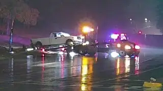 Rain, Barriers, and Bad Decisions: High-Centered Truck Raises DUI Suspicions!