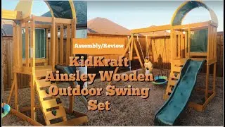 KidKraft Ainsley Wooden Outdoor Swing Playset with Slide, Chalk Wall, Canopy and Rock Wall | 2022