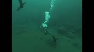 Touring Fortune Pond Michigan with my scooter with 2 scuba divers