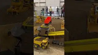 RC dump truck dumping dirt at Cabin Fever Expo