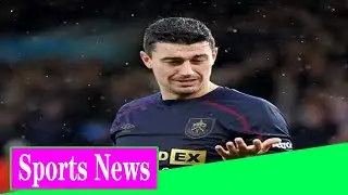 Burnley defender Matthew Lowton is hit in the face by a BOTTLE thrown from the stands as he celebrat