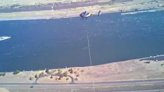 MD 500 pulling rope across the Columbia river