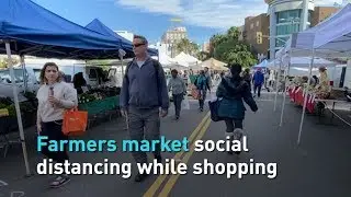 Farmers market social distancing while shopping