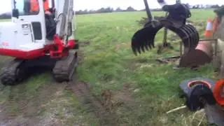 Mini digger with grab