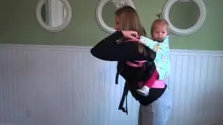 Back carry in Kinderpack: Swing around method