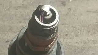 Laser cleaning an old very dirty spark plug.
