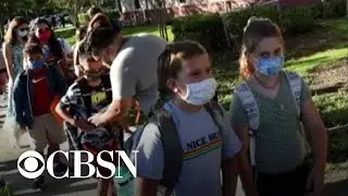 Florida mask debate amid COVID surge complicates start of school year