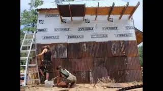 Putting reclaimed metal on the side of my tiny house