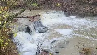 a waterfall during rain showers