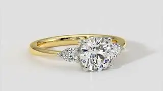 Round Brilliant Cut Diamond Ring With Pear Shape Side Diamonds In Yellow and White Gold &ndash; ADN
