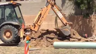 Water main break creates 12-foot sinkhole