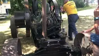 Starting a Ruston Hornsby engine with the starting crank handle. 