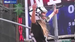 Cara Delevingne dances in football helmet on top of taxi