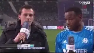 Mandanda Saves this Reporter from a water bottle thrown from the crowd.