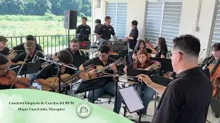 Orquesta de Cuerdas del RUM lleva alegría navideña al Hogar Casa Linda