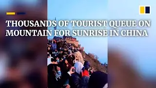 Thousands of tourists queue to see sunrise on Mount Tai on Labour Day