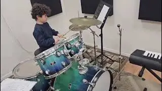 7 years old Hani is practicing on drums