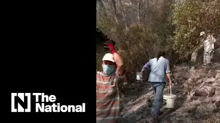 Villagers in southern Turkey use buckets to fight fires as they plead for help