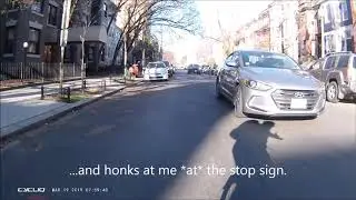 Motorist accelerating into an all-way stop...to teach me a lesson....
